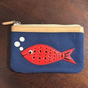 Brighton coin purse with fish, motif, and label in the back.